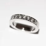 White gold wedding ring with 16 diamonds.
